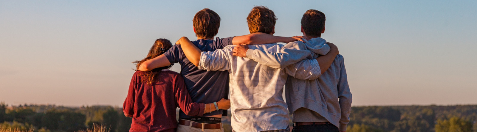 Friends with arms entwined 